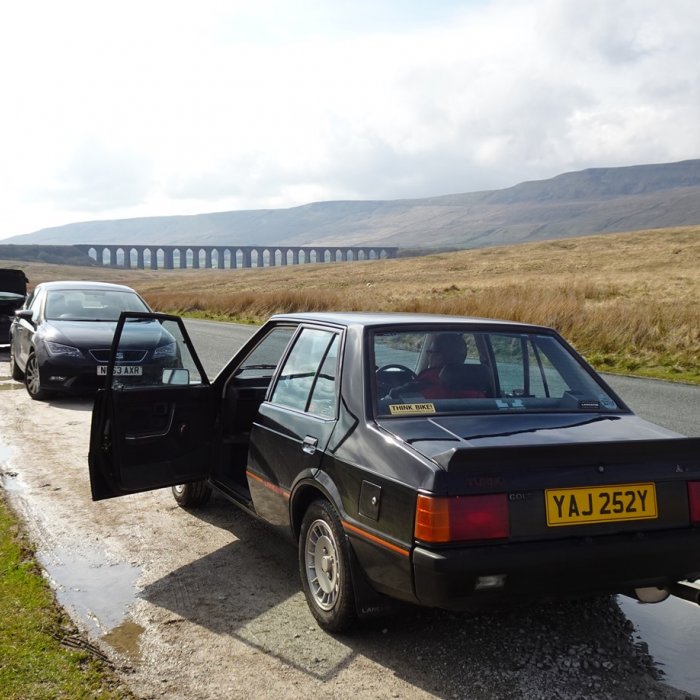 Maurice's Colt Lancer Turbo in front of the Ribblehead Viaduct.